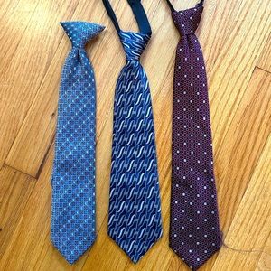 Three boys suit ties.